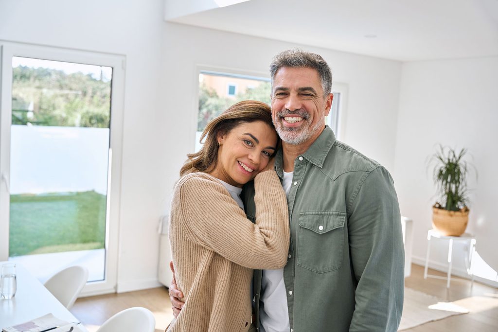 Middle aged couple enjoying the health benefits of dryer vent cleaning in the villages.